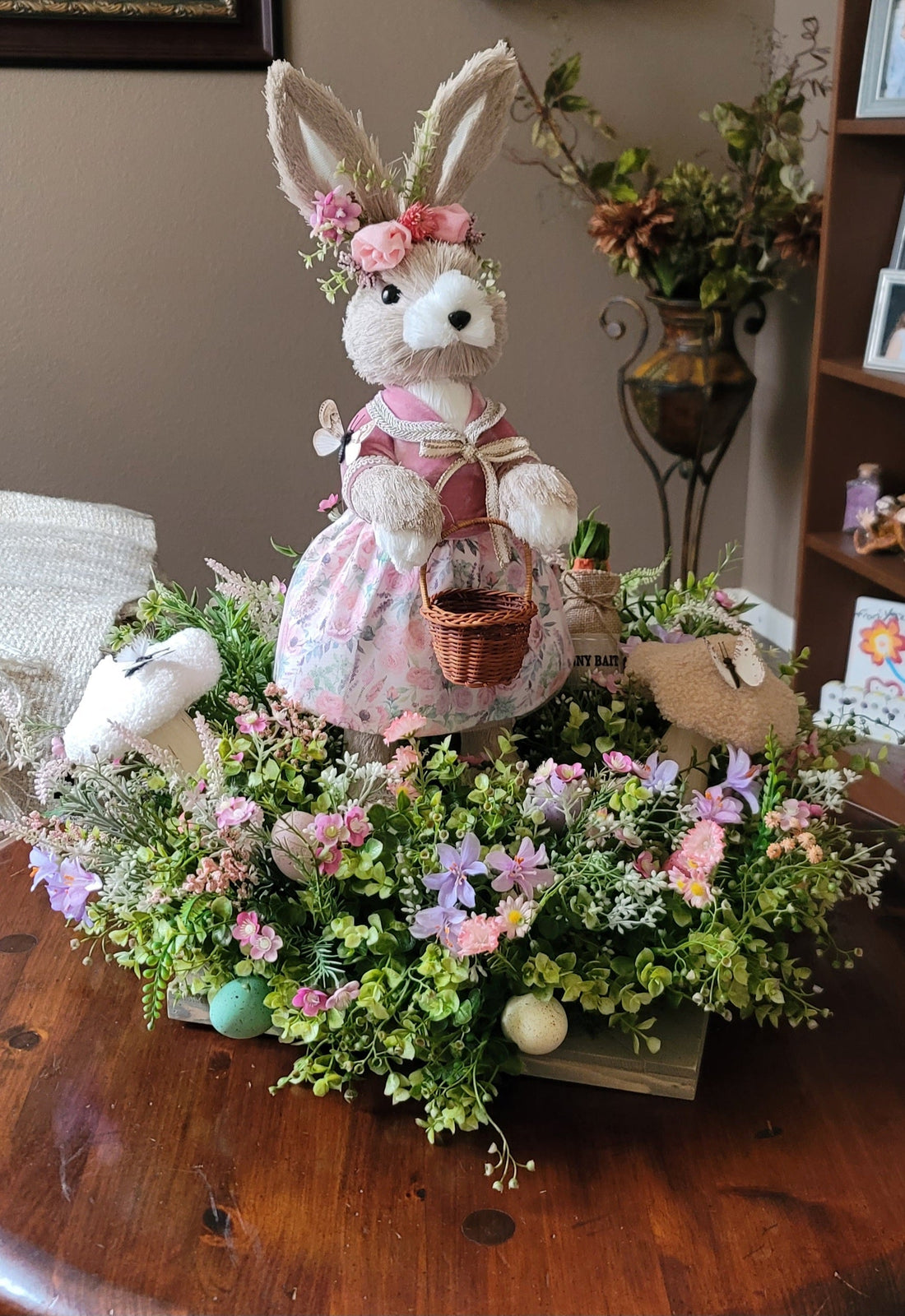 Handmade spring bunny centerpiece with pastel flowers and Easter decorations