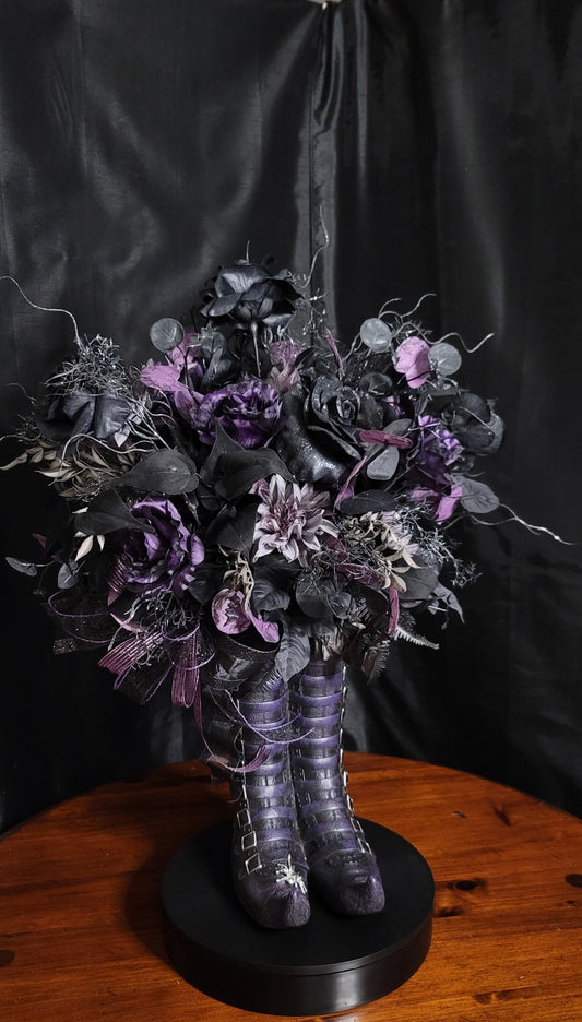 Purple and black Witchy Boot Halloween Centerpiece on a round black base